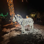 A zebra-shaped light display sculpture illuminated with pure white LED and outdoor textiles in black and white