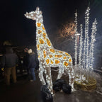 Large lighted giraffe at zoo holiday display