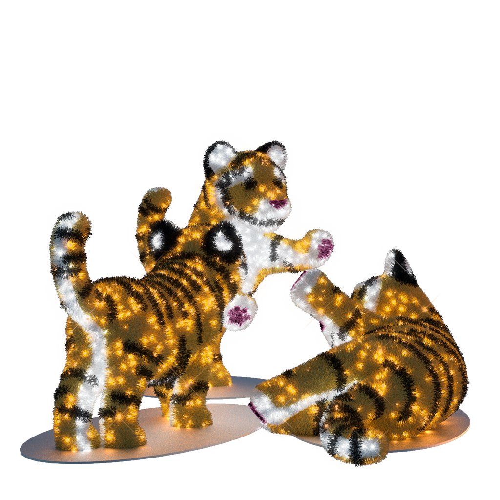 three illuminated tiger cubs
