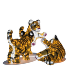 three illuminated tiger cubs